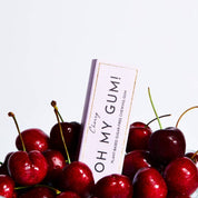 Cherry-based product packaging with cherries on a white background