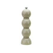 Beige lacquer pepper grinder on a white background